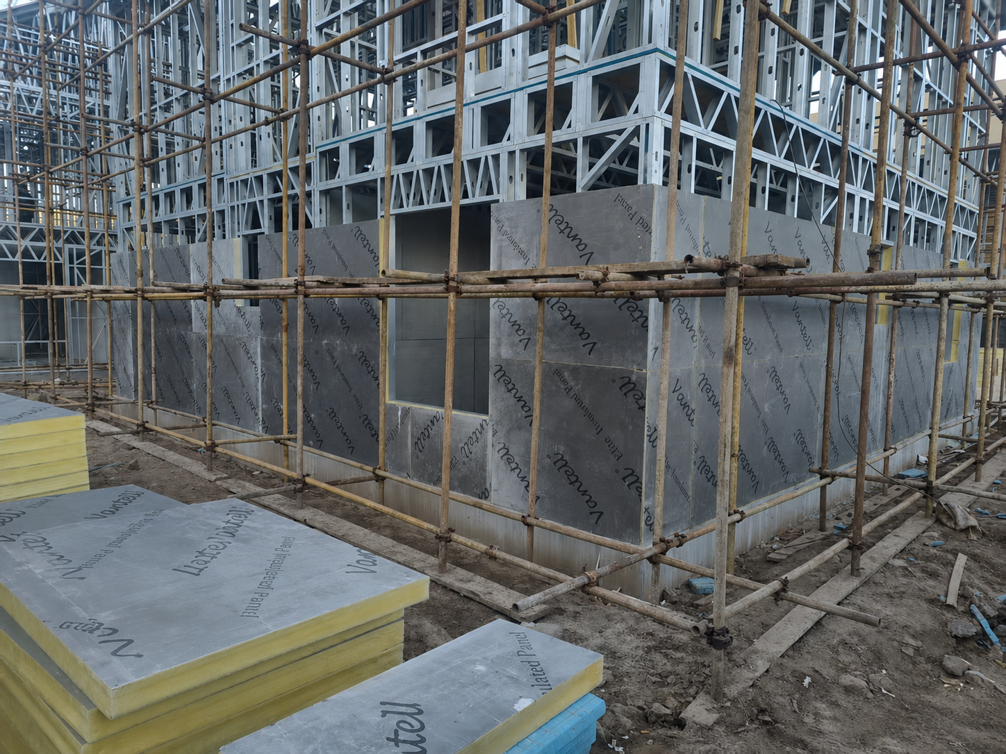 Vantell Self-Adhesive Housewrap VWC523SA applied over the exterior MGO surface of the Vantell Elite Insulated Panel before rainscreen and cladding installation